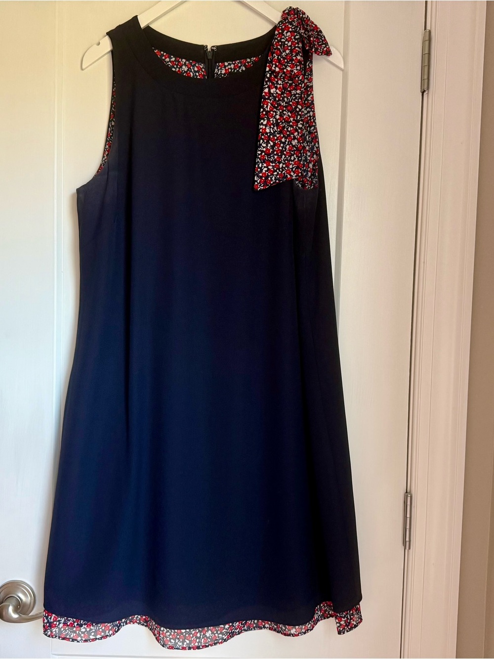 Tamari Sleeveless Navy Dress with Red Floral Bow Accent